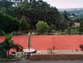 Residential Red Tennis Court with Red Surround