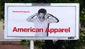 An American Apparel advertisement shown on a junior poster billboard.