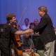 Cellist Ben Fryxell (l) Shakes Hands 
With KSO Conductor J.R. Cassidy