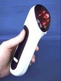 Equilux infrared massage, held in hand