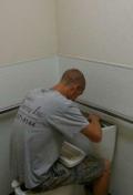 Speake's Plumbing Specialist Repairing Toilet