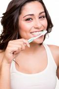 Woman holding a tooth brush