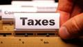 tax or taxes concept with word on business folder index blog