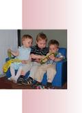 Children of Woodbrook members playing together on sofa