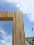 Detail image of contemporary mirror built with zebrawood veneer. Zebrawood is natural with a clear protective finish.