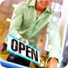 small business owner holding open sign