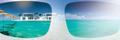 transparent sunglasses and ocean beachfront home image for guide to buying sunglasses