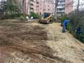 Scrubnik at work. We deliver and installed 60 tons of top soil at this project and seeded and entire new lawn!!