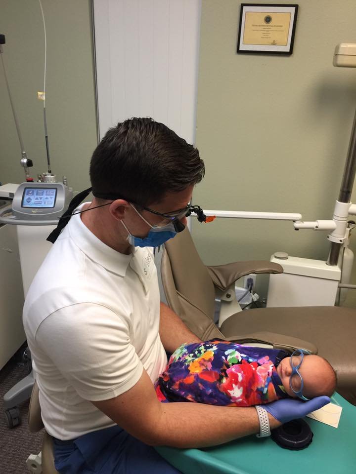 Dr Warcup with pediatric patient at North Texas Smiles Pediatric Dentistry & Orthodontics Fort Worth TX