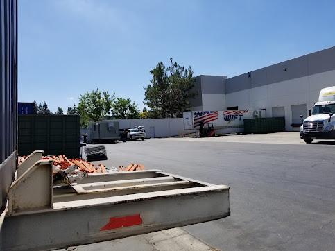 Truck loading dock behind warehouse facility
